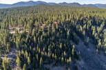 Nestled amidst a lush forest, this property offers a serene escape with stunning natural views.