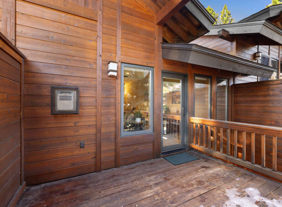 This stunning property boasts a beautiful wooden exterior, creating a warm and inviting atmosphere.