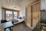 Discover the charm of this cozy apartment, featuring a beautifully designed bedroom with a comfortable bed and stylish decor.