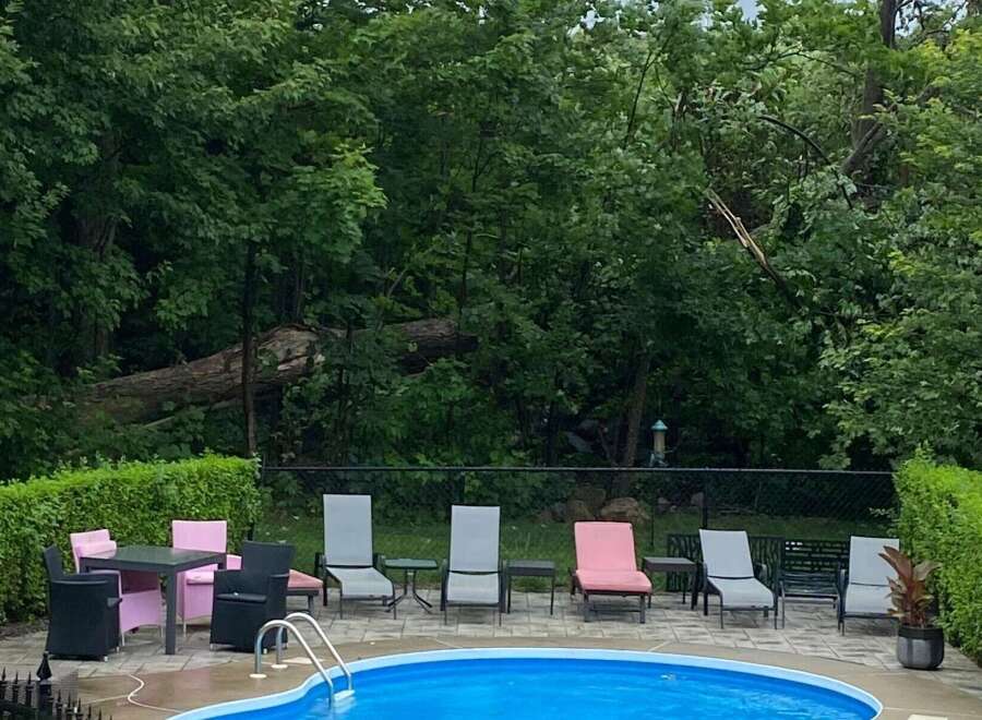Enjoy luxurious outdoor living with this stunning property featuring a private pool and ample seating areas.