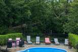 Enjoy luxurious outdoor living with this stunning property featuring a private pool and ample seating areas.
