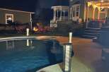 Enjoy evenings by the pool in this stunning property! This home features a beautiful outdoor space with a cozy fire pit, perfect for entertaining.