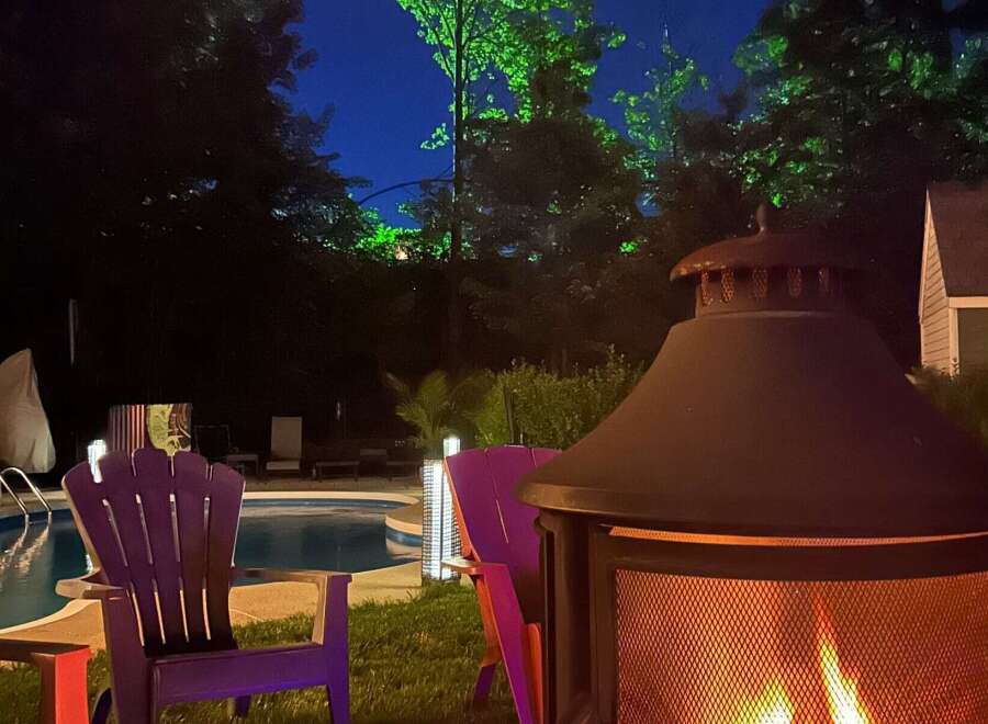 Enjoy evenings in this stunning outdoor oasis! This property features a cozy fire pit, perfect for gatherings, and a refreshing pool for those warm summer days.