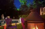 Enjoy evenings in this stunning outdoor oasis! This property features a cozy fire pit, perfect for gatherings, and a refreshing pool for those warm summer days.