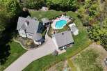 Discover your dream home with this stunning property featuring a private pool and lush landscaping.