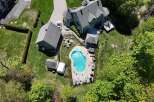 Discover luxury living in this stunning property featuring a private pool and lush landscaping.