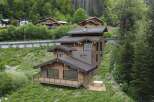 Discover the epitome of mountain living in this stunning chalet nestled amidst lush greenery.
