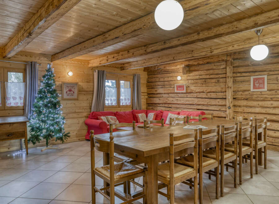 Step into this inviting chalet-style home, featuring a spacious dining area perfect for gatherings.