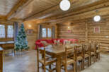 Step into this inviting chalet-style home, featuring a spacious dining area perfect for gatherings.