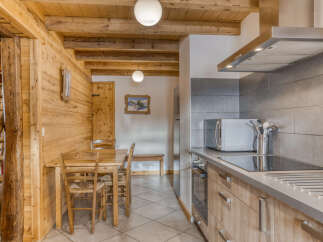 Step into this charming kitchen, featuring a rustic wooden design that exudes warmth and character.
