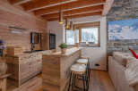 This stunning property boasts a rustic, yet modern design, perfect for those seeking a cozy retreat.