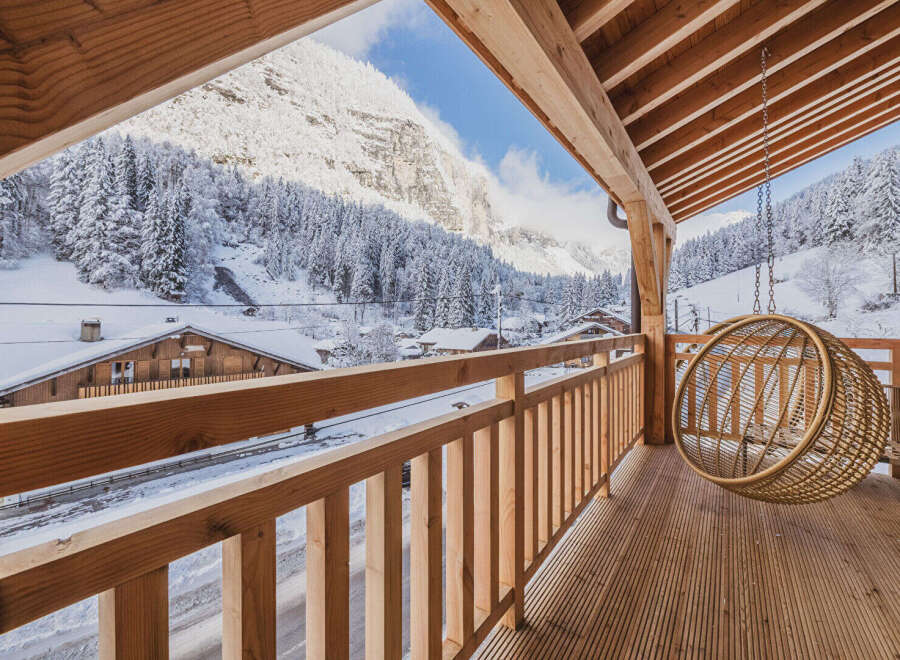 Experience the ultimate winter escape in this stunning property, boasting breathtaking views of snow-covered mountains and lush forests.