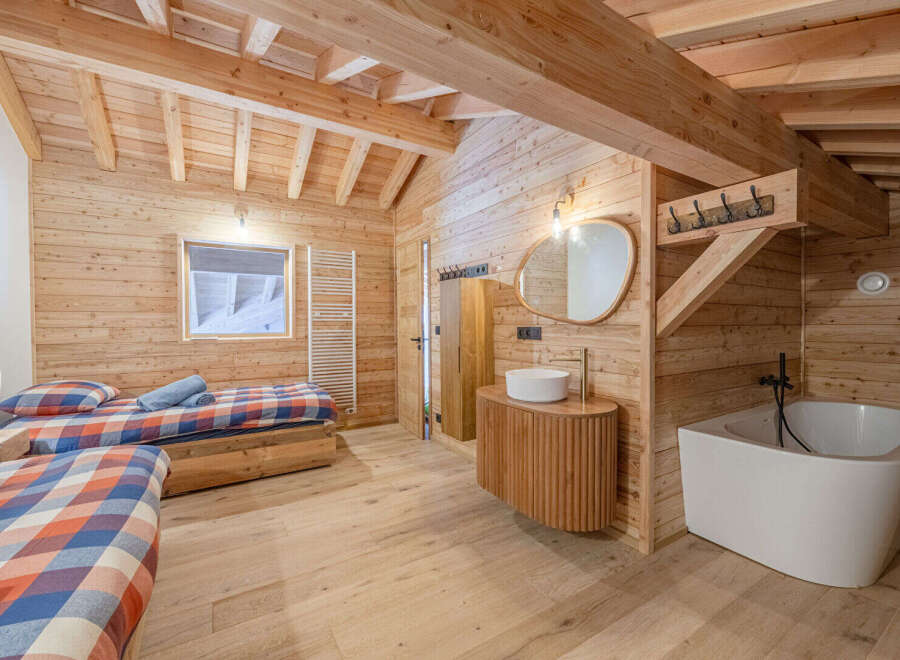 Experience rustic luxury in this stunning wooden-clad chalet.