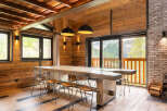 This stunning property boasts a rustic yet modern interior, perfect for those seeking a luxurious mountain retreat.