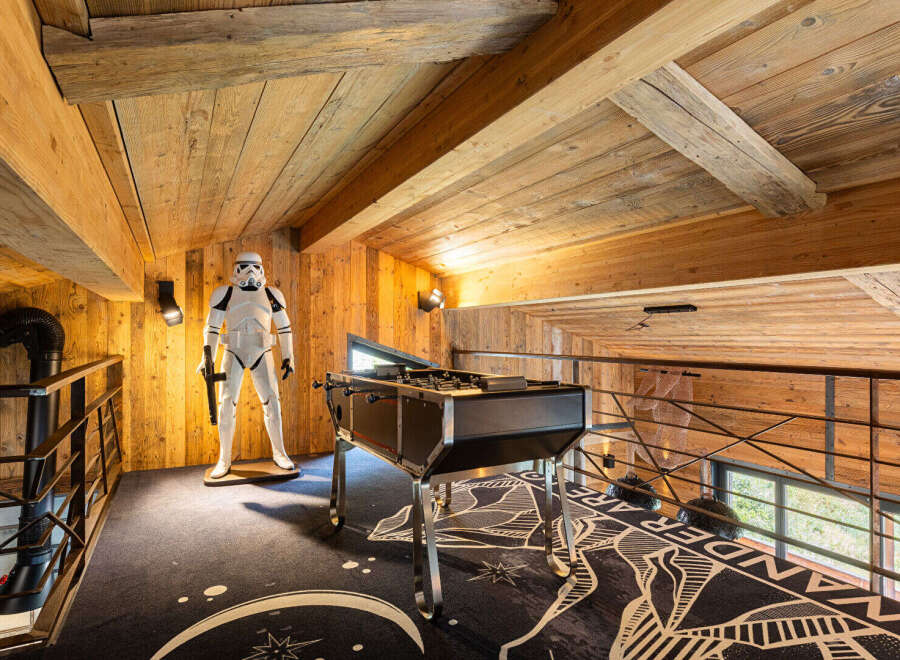 Step into a unique space with this property, featuring a stunning wooden ceiling and walls that exude warmth and character.