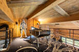 Step into a unique space with this property, featuring a stunning wooden ceiling and walls that exude warmth and character.