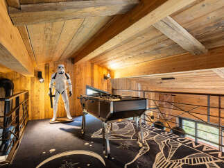 Step into a unique space with this property, featuring a stunning wooden ceiling and walls that exude warmth and character.