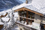 Experience the ultimate winter getaway in this stunning chalet nestled in a snowy mountain landscape.