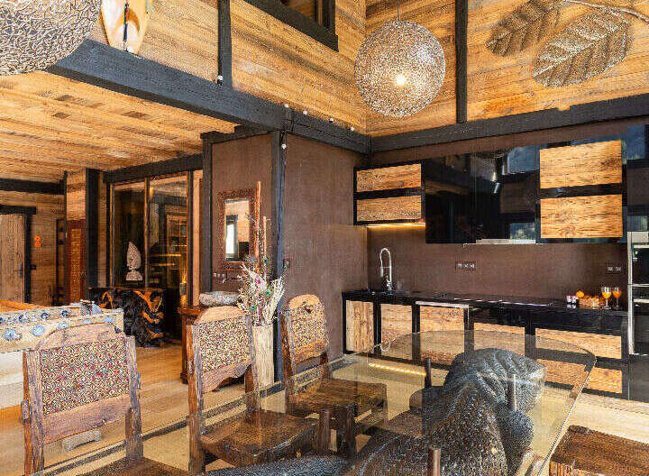 Experience rustic luxury in this stunning property, featuring a unique wooden interior and high ceilings.