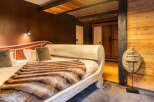 Experience rustic elegance in this stunning bedroom.