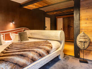 Experience rustic elegance in this stunning bedroom.