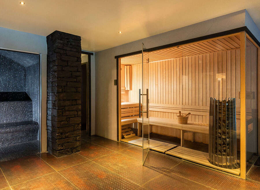 Step into luxury with this stunning sauna and steam room.