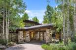 This stunning property boasts a beautiful stone facade and a welcoming entrance.
