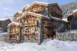Experience luxury living in this stunning chalet nestled in a winter wonderland.
