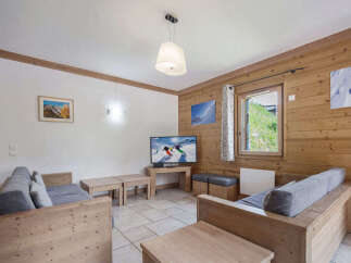 Discover the charm of this cozy living space, perfect for relaxing after a day on the slopes.