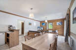 This charming property features a spacious open-plan living area, perfect for entertaining.