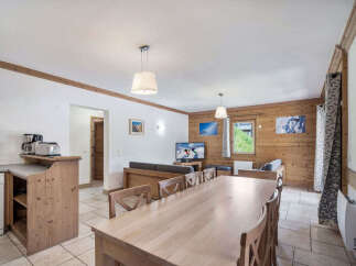 This charming property features a spacious open-plan living area, perfect for entertaining.
