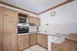 This charming kitchen boasts a warm and inviting atmosphere, perfect for culinary adventures.