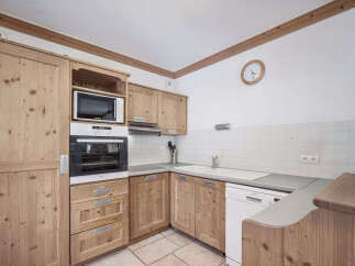 This charming kitchen boasts a warm and inviting atmosphere, perfect for culinary adventures.