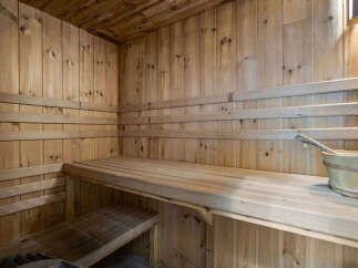 Step into relaxation with this stunning sauna.