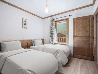 Discover the charm of this cozy bedroom, perfect for a relaxing getaway.
