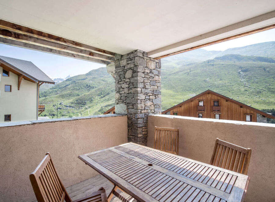 Enjoy breathtaking mountain views from this charming balcony.