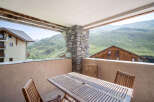 Enjoy breathtaking mountain views from this charming balcony.