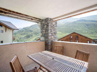 Enjoy breathtaking mountain views from this charming balcony.