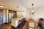 Step into luxury with this stunning kitchen and dining area! Featuring a spacious island with seating, stainless steel appliances, and elegant pendant lighting, this space is perfect for both cooking and entertaining.