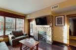 Experience luxury living in this stunning property featuring a cozy fireplace, perfect for chilly evenings.