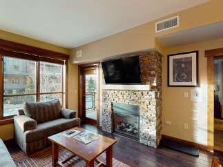 Experience luxury living in this stunning property featuring a cozy fireplace, perfect for chilly evenings.
