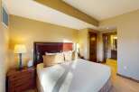 This luxurious bedroom features a comfortable king-sized bed with a stylish headboard and plush pillows.