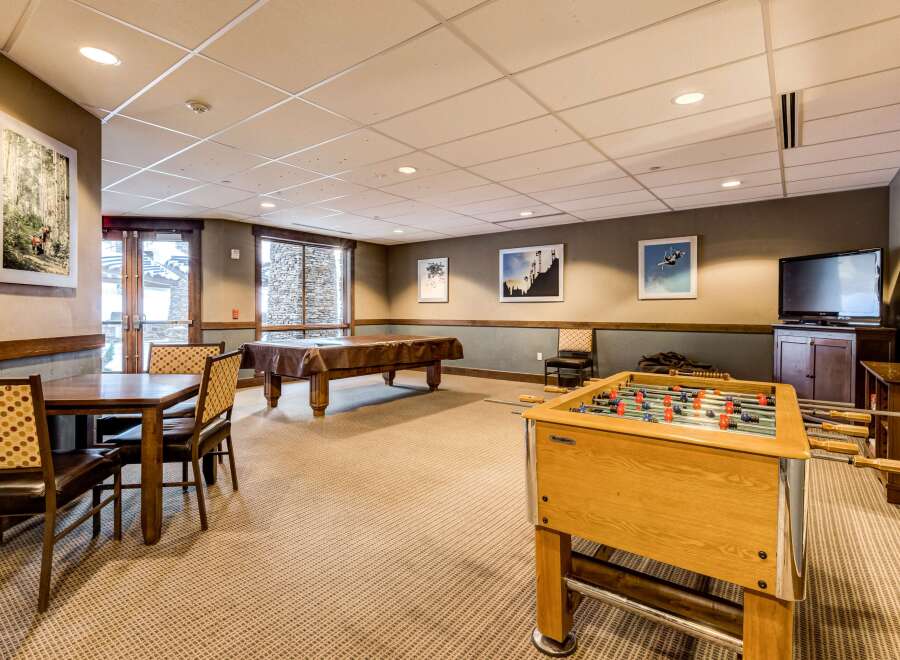 This inviting game room offers a perfect blend of entertainment and relaxation.
