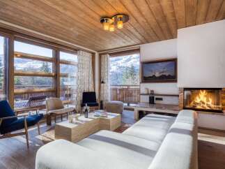 Experience luxury living in this stunning property featuring a cozy fireplace, perfect for chilly evenings.