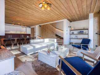 Experience luxury living in this stunning property featuring a cozy fireplace and a modern, open-plan design.