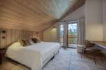 Experience the epitome of alpine luxury in this stunning bedroom.