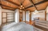 Step into this unique property featuring a stunning wooden ceiling with exposed beams, creating a warm and inviting atmosphere.