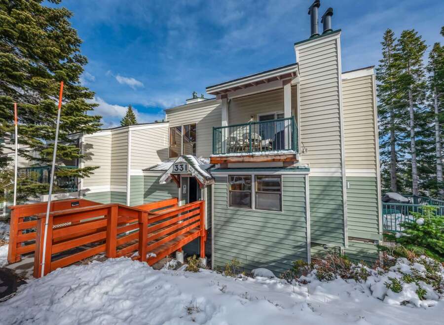 Discover a charming property nestled in a serene, snow-covered landscape.