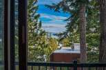 Enjoy breathtaking views from this stunning property! This home offers a serene escape with its picturesque surroundings, including lush trees and a glimpse of the mountains.