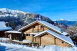 Discover the charm of this stunning chalet nestled in a picturesque winter wonderland.